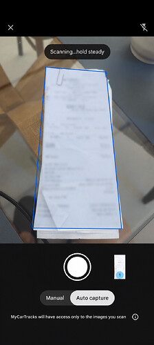Receipt scanner outlining a receipt with blurred text and Auto capture selected